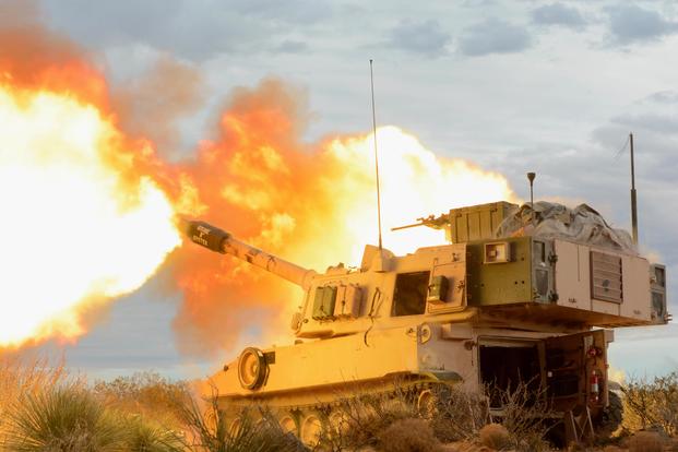 An M109 Paladin gun crew with B Battery, 4th Battalion, 1st Field Artillery Regiment, Division Artillery, at Fort Bliss, Texas, fires into the mountains of Oro Grande Range Complex, New Mexico, on Feb. 14, 2018.(U.S. Army photo by Spc. Gabrielle Weaver) 