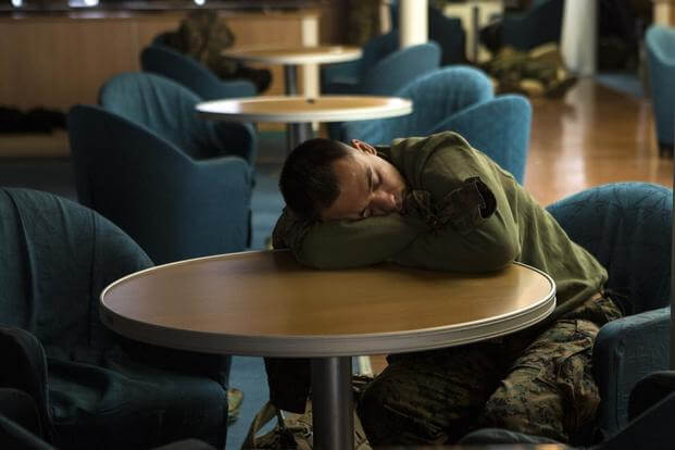 U.S. Marines and sailors with III Marine Expeditionary Force (III MEF) find places to sleep and be comfortable to get rest before arriving to support Marine Expeditionary Force Exercise (MEFEX) 2014, March 9, 2014 (U.S. Marine Corps/Cpl. Sara A. Medina)