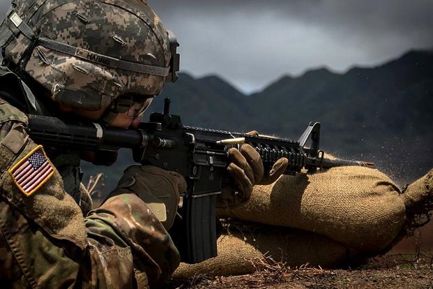 Spc. James Harris, assigned to 1st Brigade Combat Team, 25th Infantry Division, U.S. Army Alaska, zeroes his M4A1 carbine rifle on day one of the Pacific Theater Best Warrior Competition on June 12, 2017, at Schofield Barracks, Hawaii. (U.S. Army photo by Cpl. Michelle U. Blesam)