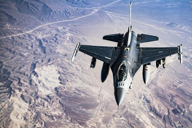 A U.S. Air Force F-16C Fighting Falcon pilot maneuvers into position to conduct refueling operations with a KC-135 Stratotanker over Afghanistan in support of Operation Freedom's Sentinel, March 11, 2018. (U.S. Air Force/Tech. Sgt. Gregory Brook)