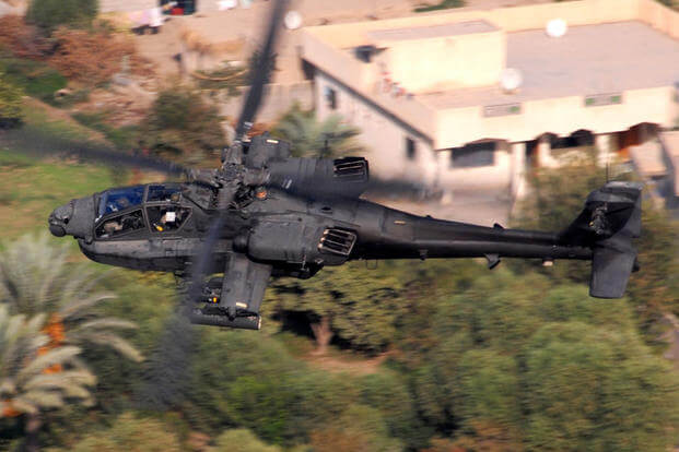 An AH-64D Apache from Company B, 1st Attack Battalion, 227th Aviation Regiment, 1st Air Cavalry Brigade, 1st Cavalry Division, flies over a residential area in the Multi-National Division-Baghdad area Oct. 12, 2007. (Photo: U.S. Army/Chief Warrant Officer 4 Daniel McClinton)