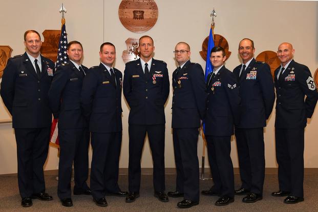 From left, Col. Julian C. Cheater, 432nd Wing/432nd Air Expeditionary Wing commander, retired Maj. Asa, former 432nd WG MQ-9 Reaper pilot; Capt. Evan, 432nd WG MQ-9 pilot; Capt. Abrham, 432nd WG MQ-9 pilot; 1st Lt. Eric, 432nd WG MQ-9 pilot and Senior Airman Jason, 432nd WG sensor operator pose for a photo July 11, 2018, at Creech Air Force Base, Nev. (U.S. Air Force/Senior Airman James Thompson)
