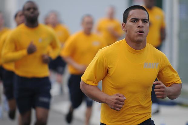 Sailors assigned to the forward-deployed amphibious assault ship USS Essex (LHD 2) participate in command physical training in Sasebo, Japan, in 2011. The Navy is phasing out this version of the PT uniform. (U.S. Navy photo by Mass Communication Specialist 3rd Class Adam M. Bennett)
