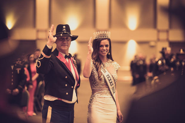 Logan Lester, Miss Texas, USA and Lt. Col Joey Errington, 3-16th FA commander, takes part in the Order of Saint Barbara awards ceremony during 3-16th FA's Battalion Ball. (U.S. Army/Carson Petry).