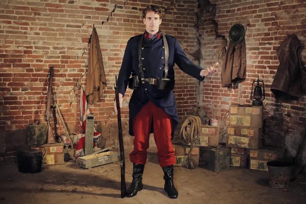 Historian Dan Snow models a French army uniform from early World War I in a BBC segment. (YouTube/BBC)