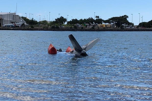 The tail section of a privately-owned Hunter Hawker aircraft is salvaged in the waters off Honolulu, Jan. 8, 2018. The Coast Guard coordinated with State of Hawaii and private parties to conduct the operation following a crash in December 2018. (U.S. Coast Guard photo/Russ Strathern)