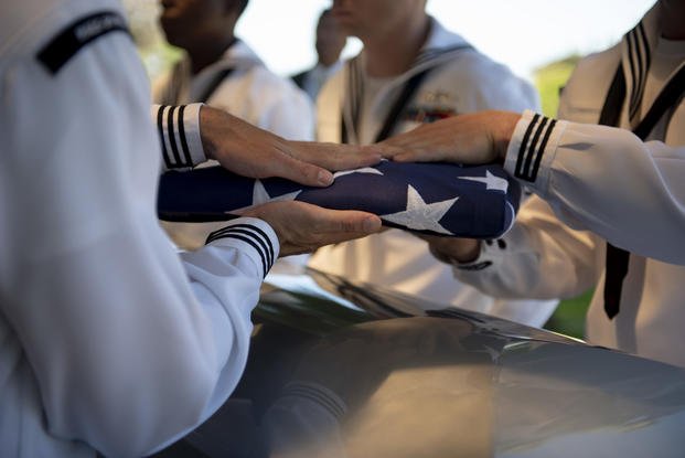 Sailors assigned to Navy Region Hawaii fold the American flag over the remains of U.S. Navy F1c Grant Clark COOK Jr. at the National Memorial Cemetery of the Pacific, Honolulu, Hawaii, May. 09, 2019.  (Jamarius Fortson/U.S. Army)