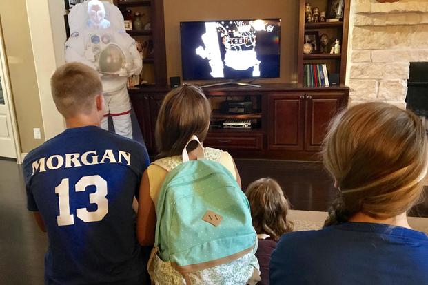 The Morgan family watches as Army Col. Drew Morgan makes a spacewalk outside the International Space Station. Courtesy photo
