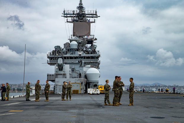 U.S. Marines with Special Purpose Marine Air-Ground Task Force- WASP, stand on the flight deck while leaving Naval Base San Diego aboard the USS Wasp (LHD 1), Sept. 26, 2019. (U.S. Marine Corps photo/Teagan Fredericks)