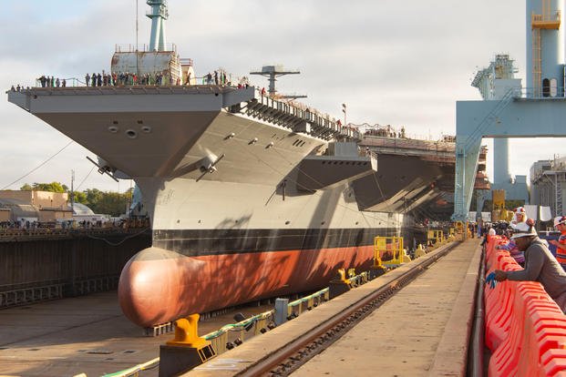 Pre-Commissioning Unit (PCU) John F. Kennedy (CVN 79) reaches another milestone in its construction as their dry dock area is flooded three months ahead of its slated production schedule leading up to the christening of the second Ford-class aircraft carrier, scheduled for Dec. 7, 2019. (U.S. Navy photo/Adam Ferrero)