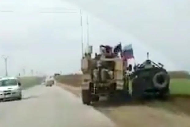 U.S. military vehicle runs a Russian armored truck off the road in Syria