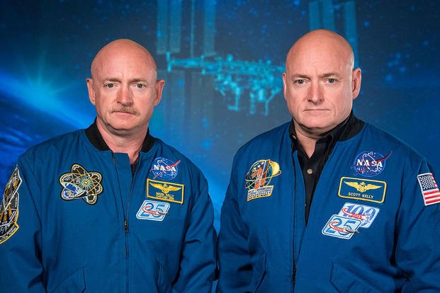 NASA Expedition 45/46 commander, astronaut Scott Kelly, is shown with his brother, former astronaut Mark Kelly at the Johnson Space Center in Houston on Jan. 19, 2015. (Robert Markowitz/NASA photo)
