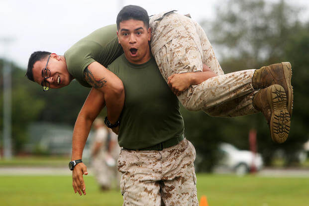 Marines participate in fireman carry.