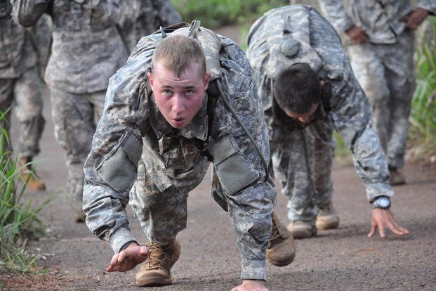 Soldiers bear-crawl during a physical readiness training competition.