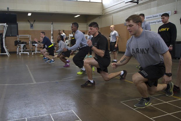 Students of the Master Fitness Trainer Course conduct the lunge walk at Fort Campbell, Kentucky.