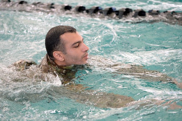 A soldier in a Special Forces Qualification Course completes a swim test.