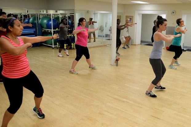 Participants in a Zumba class dance to high-energy music at Scott Air Force Base, Illinois.