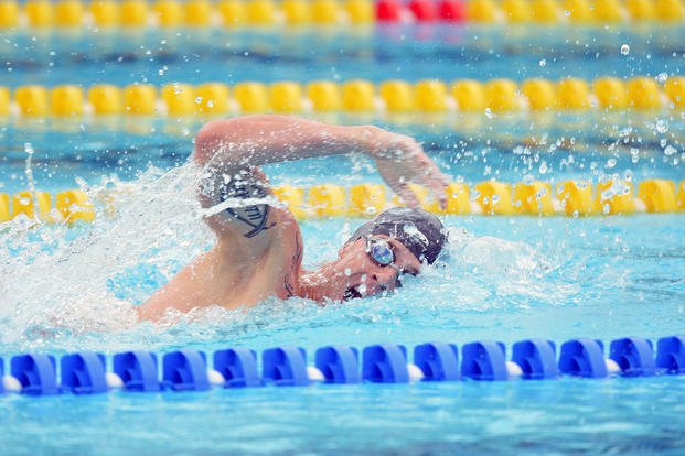 An Army soldier swims during the modern pentathlon at the 2016 Olympics in Rio de Janeiro.