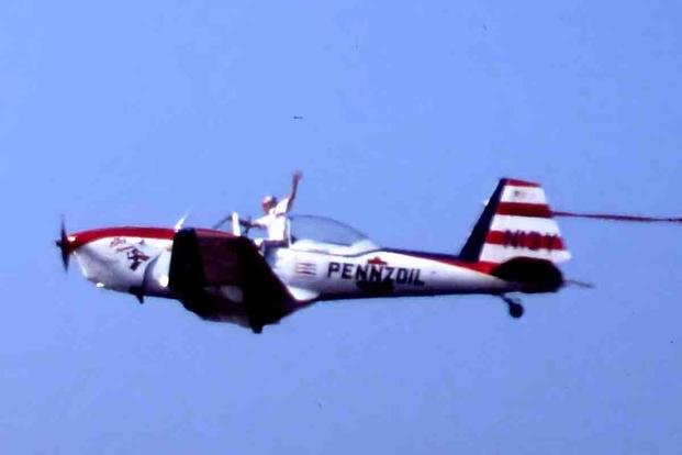 Art Scholl flying his Super Chipmunk N13Y at an airshow in California in 1984.