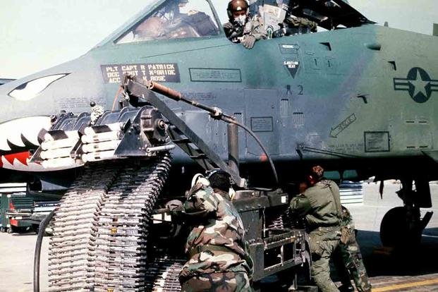 Munitions specialists from the 23rd Tactical Fighter Wing, England Air Force Base, La., load 30 mm rounds of ammunition into an A-10A Thunderbolt II attack aircraft for its GAU-8/A Avenger cannon prior to a sortie in support of Operation Desert Storm. (U.S. Air Force)