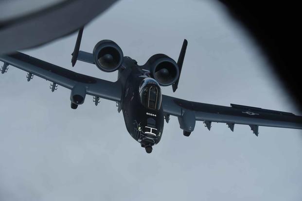 A black and grey U.S. Air Force A-10 Thunderbolt II from the Indiana Air National Guard’s 122nd Fighter Wing “Blacksnakes,” flying home on July 7, 2021. The A-10 is on its way back to Fort Wayne Ind. after being painted at the Air National Guard paint facility in Sioux City, Iowa. The paint scheme, a departure from the standard two-tone grey, was created by request in order to commemorate the 100th anniversary of aviation in the Indiana National Guard. (U.S. Air National Guard photo: Senior Master Sgt. Vincent De Groot) A black and grey U.S. Air Force A-10 Thunderbolt II from122nd Fighter Wing.