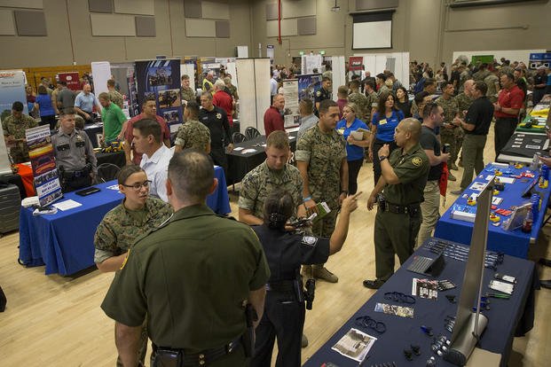 Active-duty service members, spouses and veterans attend a job fair held by Marine Corps Community Services (MCCS) at the Horno Regimental Instructional Facility at Marine Corps Base Camp Pendleton, California.