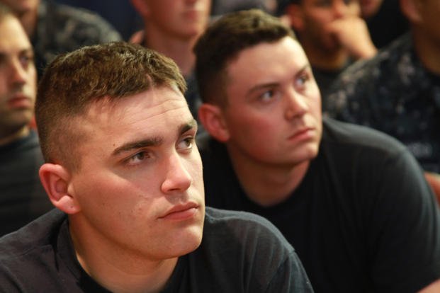 Enlisted sailors from the Washington, D.C., area listen to a presentation about officer commissioning programs during a job fair hosted by the National Capitol Region Mustang Association at Joint Base Myer-Henderson Hall.