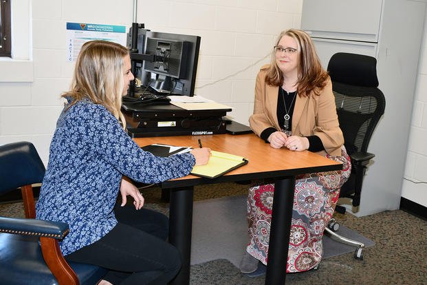 Angela Bell, VH-92 Fleet Support Team lead engineer at FRCE, meets with Rose Wagoner, MRO Engineering Dynamic Components Branch head, to discuss workplace issues.