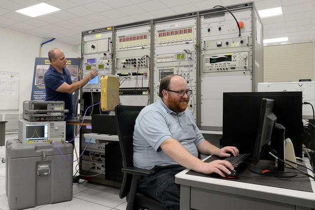 Software engineers work to organically develop automatic test equipment systems to support the F-16 at Hill Air Force Base, Utah.