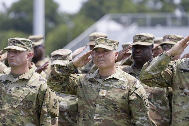 Maj. Michael Haley stands at attention.