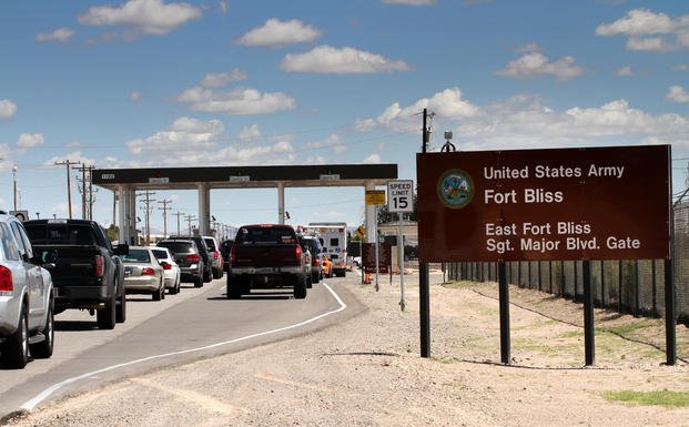 Cars wait to enter Fort Bliss. 