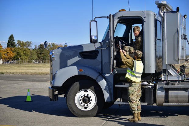 U.S. Air Force Staff Sgt. Joshua McDonald explains the commercial driver’s license test requirements to U.S. Air Force Senior Airman Trevor Heying at Fairchild Air Force Base, Washington.