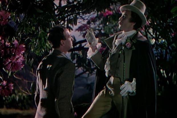 Peter (David Niven) is shown with Conductor 71 (Marius Goring) in the garden in 'A Matter of Life and Death.' (Photo courtesy of IMDB.com) Peter (David Niven) is shown with Conductor 71 (Marius Goring) in the garden in 'A Matter of Life and Death.' (Photo courtesy of IMDB.com)