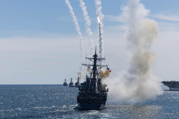 Arleigh Burke-class destroyers fire Standard Missile-2 interceptors during an October 2025 demonstration. The Navy has expended thousands of these multimillion-dollar missiles in Red Sea operations; depleting stockpiles faster than defense contractors can replenish them. (U.S. Navy photo by Mass Communication Specialist Seaman Kaitlyn Bailey)