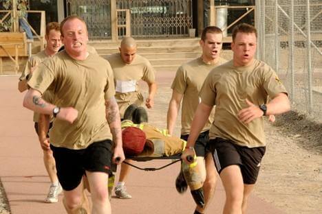 Soldiers with the British Army’s KSSG, deployed to Kandahar Airfield, Afghanistan, run during the litter carry portion of the Combat Olympics Aug. 3, 2012. Thousands of British veterans are suing 3M, an American company, for allegedly providing them with faulty ear protection while serving in Afghanistan. (Photo courtesy of Defense Visual Information Distribution System)