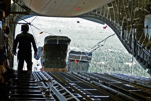 Cargo for the 82nd Airborne Division is air-dropped out the back of a C-17 Globemaster III, Oct. 29, 2015, over North Carolina, during a Joint Operation Access Exercise. (Photo by Divine Cox/U.S. Air Force)