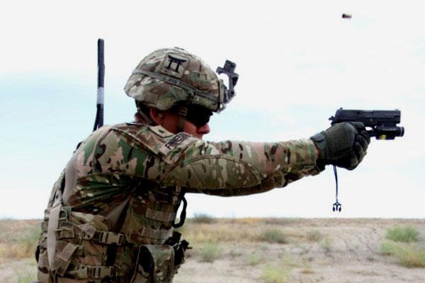 A 101st Airborne Division soldier fires a Sig Sauer pistol during weapons training on May 29, 2015 at Tactical Base Gamberi in eastern Afghanistan. (U.S. Army photo/Charlie Emmons)
