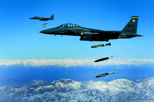 U.S. Air Force F-15E Strike Eagles drop 2,000-pound Joint Direct Attack Munitions on a cave in eastern Afghanistan in November 2009. (US Air Force photo/Michael Keller)