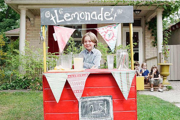 child with lemonade stand