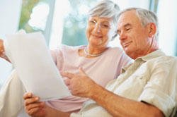 A couple looks over retirement planning documents.