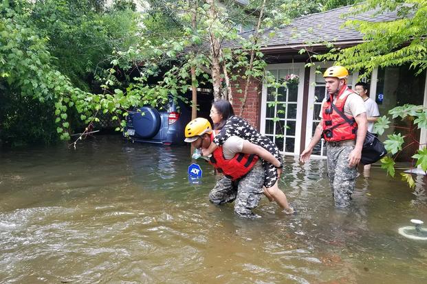 Texas National Guardsmen aid citizens in heavily flooded areas of Houston after Hurricane Harvey. Lt. Zachary West/Army
