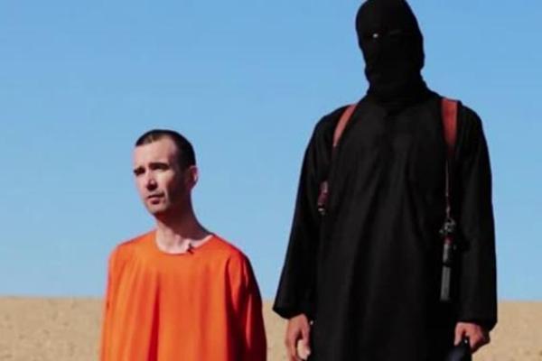 Islamic State extremists have released a video showing the beheading of British aid worker David Haines, who was abducted in Syria last year. (Associated Press)