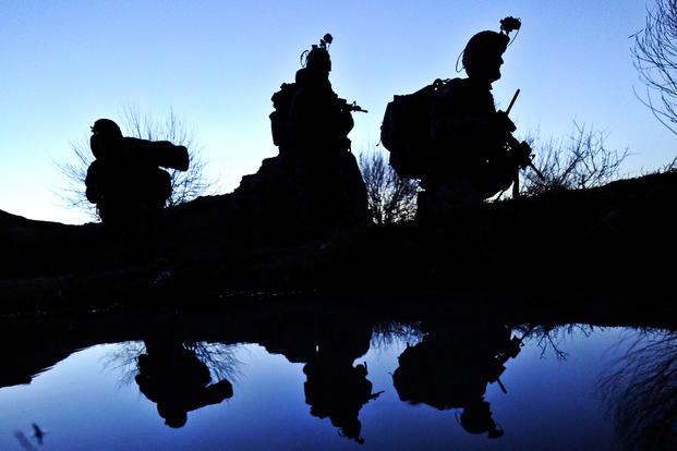 U.S. Army soldiers rest next to a canal while conducting a patrol during Operation Helmand Spider in Badula Qulp in Helmand province, Afghanistan, Feb. 15, 2010. Tech. Sgt. Efren Lopez/Air Force