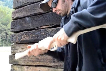 A man who would identify himself only as "Matthew" fires a homemade rifle he calls "The Grizzly 2.0" in a YouTube video. (YouTube)