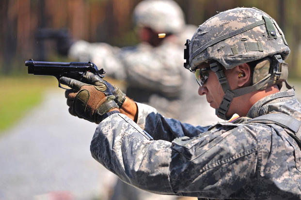U.S. Army soldiers fire M9 pistols. Army weapons officials want to replace the M9 with the Modular Handgun System. (US Army)