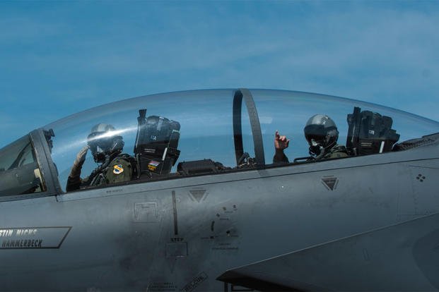 Lt. Col. Paul Hibbard, a 333rd Fighter Squadron instructor pilot, and Capt. Justin Thompson, a 333rd FS pilot, signal their crew chief as they taxi, July 22, 2015, at Seymour Johnson Air Force Base, N.C. (U.S. Air Force photo/Airman Shawna L. Keyes)