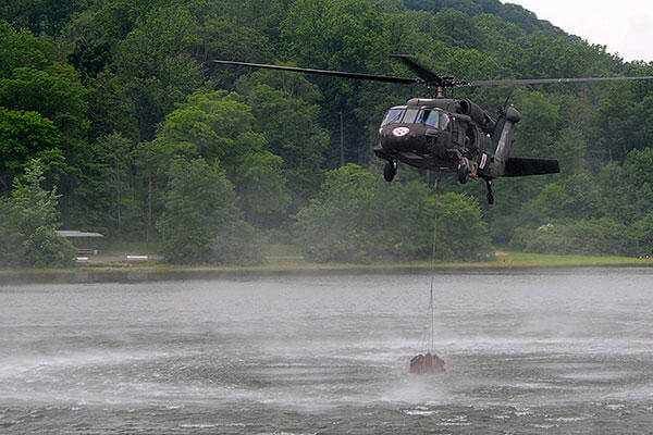 Shortly after returning to the Army in 2013, Pennsylvania Army National Guard Chief Warrant Officer 2 Sara Christensen participated in "water bucket" training at Fort Indiantown Gap, Pa. (Pennsylvania Army National Guard/Sgt. Neil Gussman)