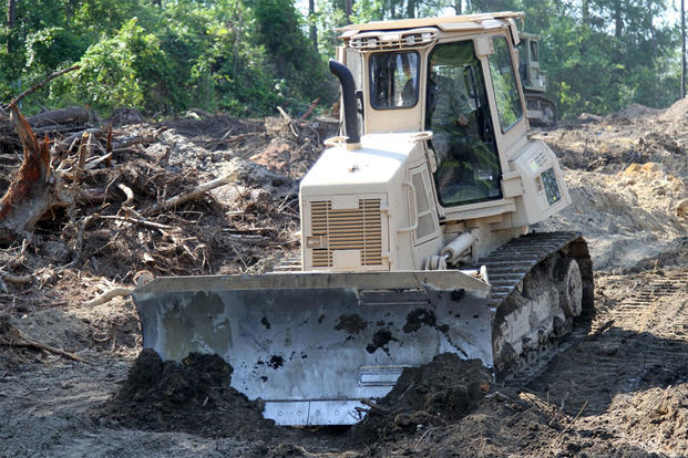 A U.S. Soldier in the 1782nd Engineer Company, South Carolina Army National Guard, operates a bulldozer while conducting annual training at the Savannah River Site in Aiken, South Carolina, June 13, 2016. (U.S. Army/Sgt. Brad Mincey)