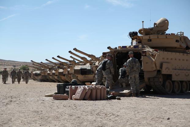 Soldiers ensure their vehicles are in good order before the activity heats up with the 1st Armored Brigade Combat Team, 34th Red Bull Infantry Division in  their training  rotation at Fort Irwin, California. (Minnesota National Guard/ Capt. Zach Strom)