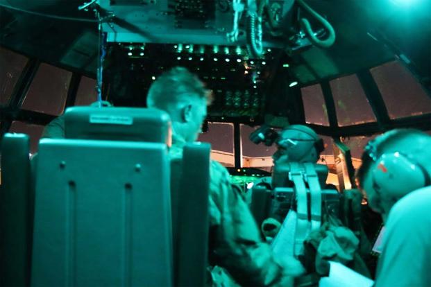 A C-130 crew gets itself ready during the night airlift ops leg of a mission. (Photo: Oriana Pawlyk/Military.com)